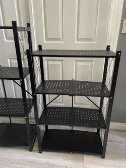 NEW Foldable Metal Storage Shelves – $40 Each / 2 for $70 Brand new heavy-duty black metal shelving units. ✅ Foldable design – easy to store & transp