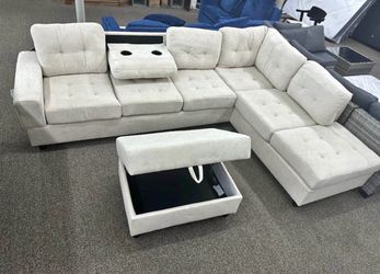 Silver / Gray Fabric Reversible Sectional with Cup Holder and Storage Ottoman. Brand New.