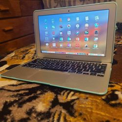 Excellent 11 inch Apple Macbook Air Laptop Computer With Intel Core i5 Processor With Programs 