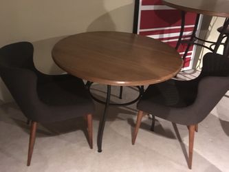 New wooden table with two mocha brown chairs