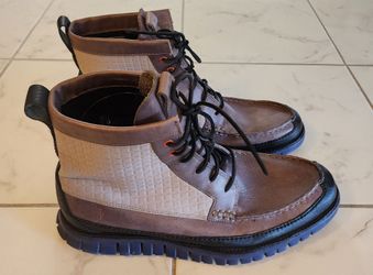 Cole Haan Zerogrand tall boots featuring a water-resistant quilted moc toe design.