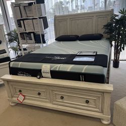 A. White Queen Sleigh Storage Footboard Bed