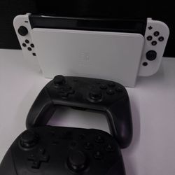 Nintendo Switch OLED with 2 Pro Controllers and SD card