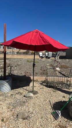Red Patio Umbrella with Decorative Base – $25