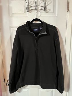 Men’s Black Size Large long sleeve pull over shirt.  Made of 100% Polyester.  Brand The Gap.  Preowned very good condition.  Smoke free home