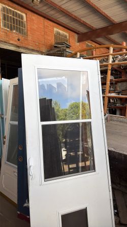 32 by 80 storm Door with Doggie Door