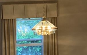 Polished brass and beveled glass 8 light chandelier