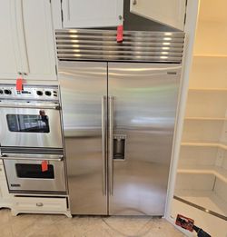 Subzero 48” stainless steel side by side built in refrigerator. Super clean tested & in working condition