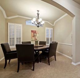 Brown pedestal round table and  6 chairs