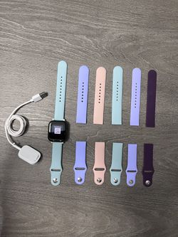 $50 Gizmo watch (Verizon) with charger cable and NEW extra bracelets
