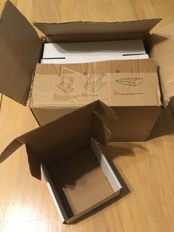23 white foldable cardboard boxes