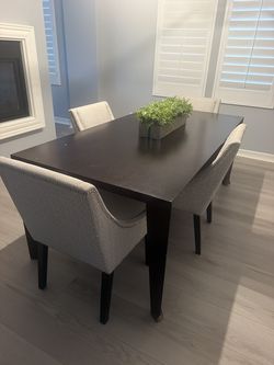 Dark espresso dining table with 6 upholstered chairs