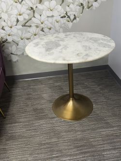 Modern, elegant pedestal side table with a clean, upscale look