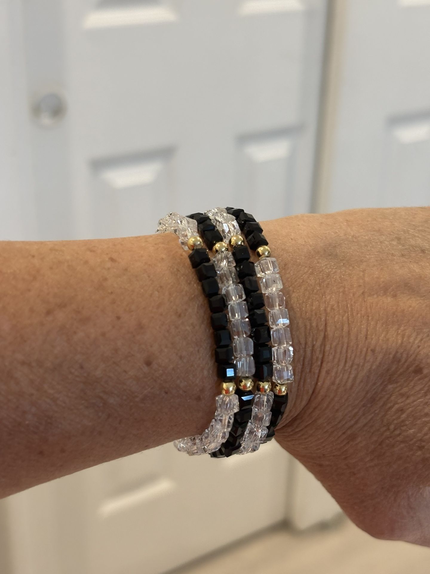 Clear Beads With Black And Gold Colored Beads
