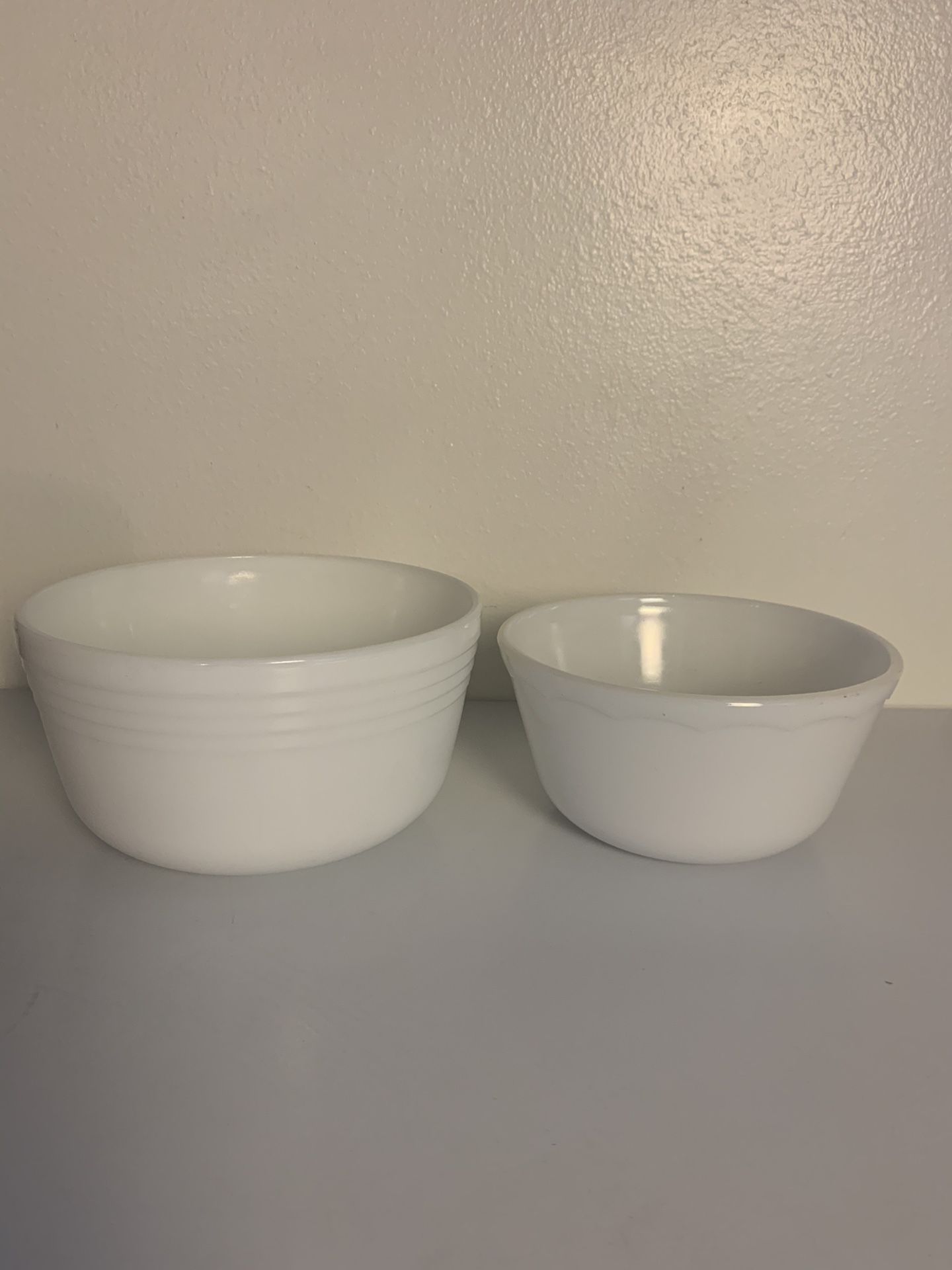 Vintage white Pyrex mixing bowl and another small mixing bowl that is not labeled