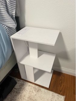 White nightstand/side table with outlets