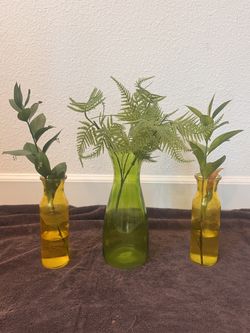 Small green glass vases
