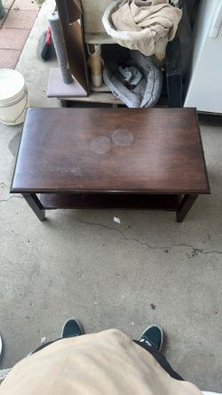 dark brown wooden coffee table with a lower shelf