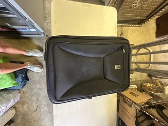 Travelpro Maxlite Black Rolling Suitcase – $40