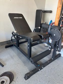 Leg extension and curl machine
