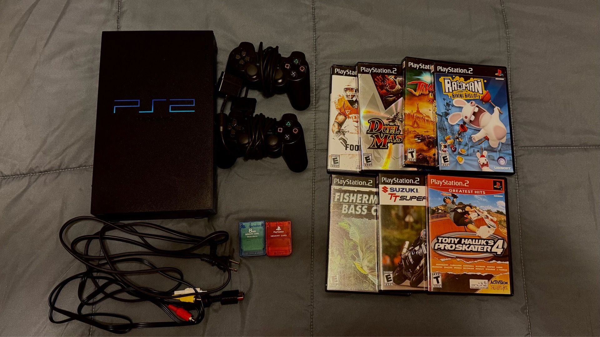 PS2 Fat Bundle With 7 games, 2 controllers, 2 memory cards, power cords, video cable.