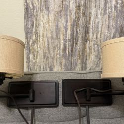 Set two wall lamps beside the bed.