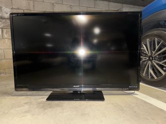 Sharp Aquos 52” liquid crystal TV/base/remote