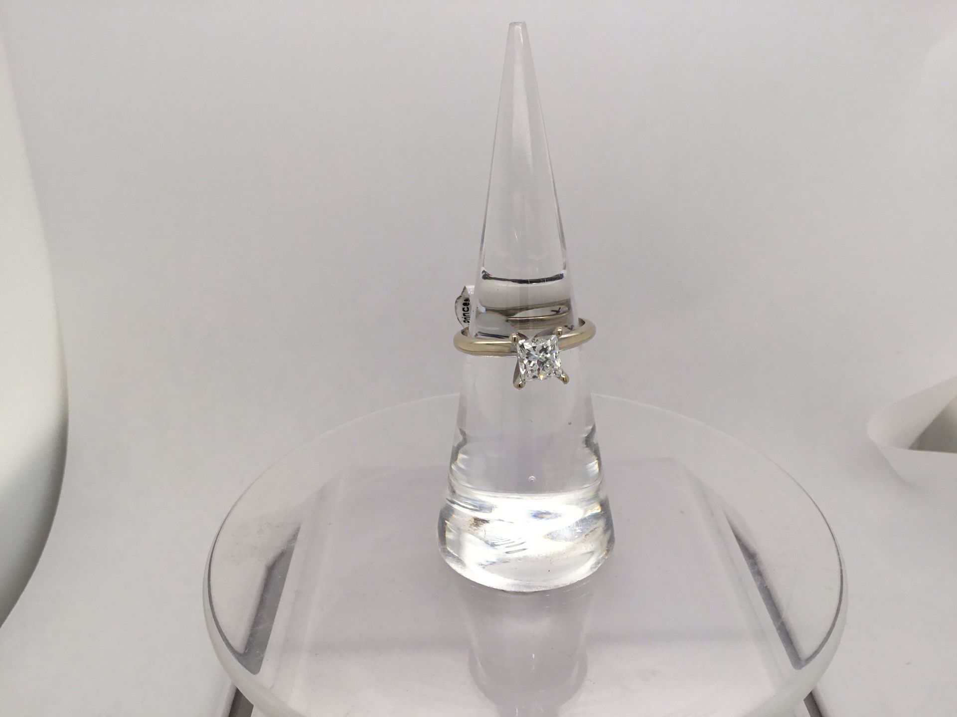 14 Karat White Gold Princess Cut Solitaire Diamond Ring.