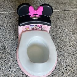Minnie Mouse training toilet with flushing sounds