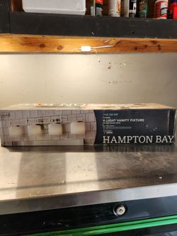 Hampton Bay Tustna 4-Light Brushed Nickel Vanity Fixture with model number 1002 230 849