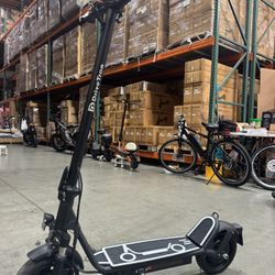 Electric scooter with shock absorption