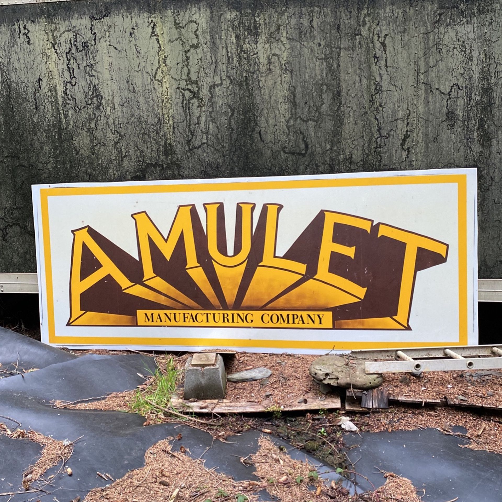 Amulet Manufacturing Sign