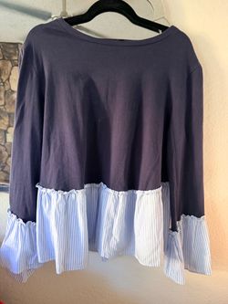Lea & Viola  Large Women’s navy blue long-sleeve mixed-media top featuring a light blue and white striped ruffed peplum hem and ruffled cuffs.