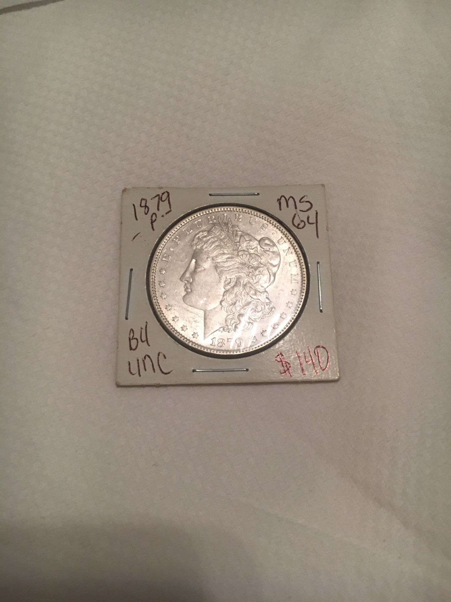 1879 P Morgan silver dollar uncirculated.