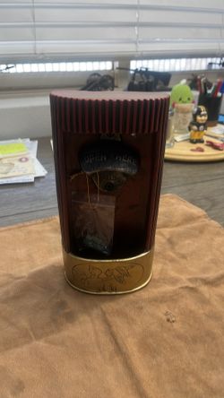 Shotgun shell bottle opener with catch storage