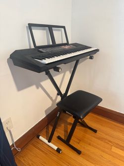 Electric Black Yamaha keyboard with stand and stool