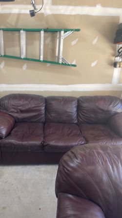 Brown sofa and love seat