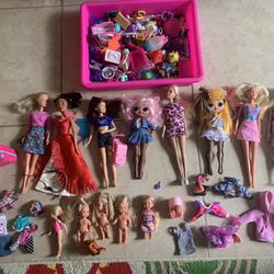A Nice OMG Collection Of Dolls With Their Clothes ,dresses And Accessories .
