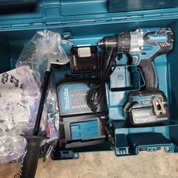 Makita Hammer Drill With 2 4ah Batteries And Charger