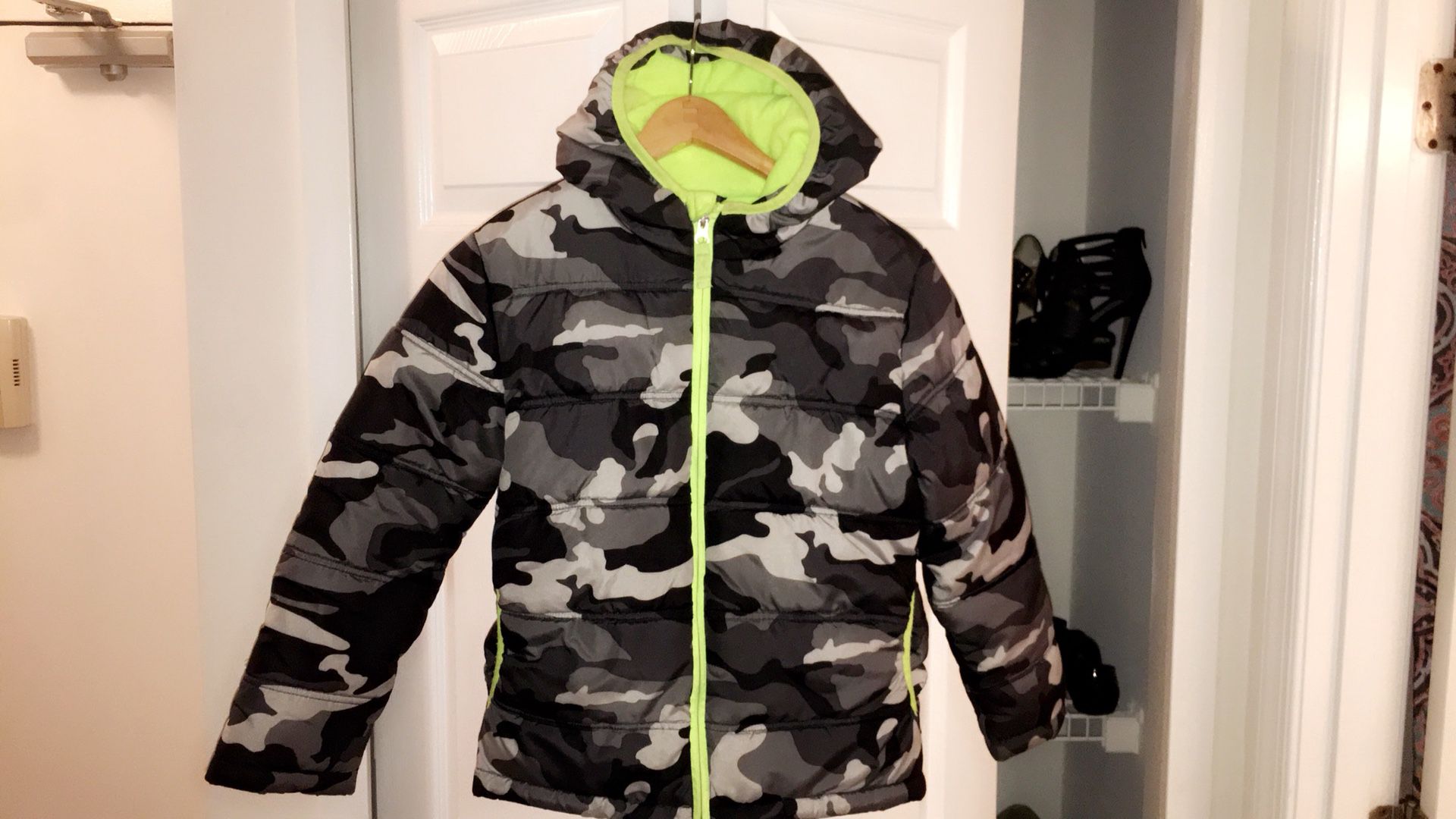 Black, green, and gray camouflage zip-up bubble jacket