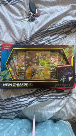 1. Two Mega Zygarde ex Premium Collection Boxes 2. One Mega Gengar ex Moonlit Tin 3. One Mega Clefable ex Moonlit Tin