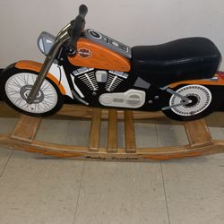 This is a Charm Company Harley-Davidson Roaring Softail Rocker, a children's rocking toy designed to resemble a Harley-Davidson motorcycle. It is made