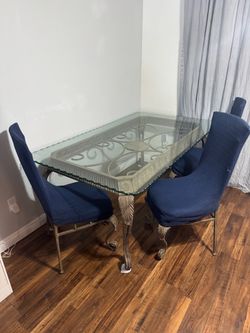 Large heavy glass table and 3 chairs see description