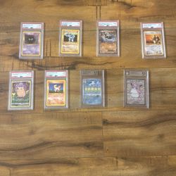 8 Graded Pokemon Cards, Some first Additions. 