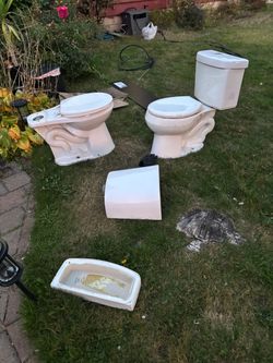Two White Ceramic Toilets for sale