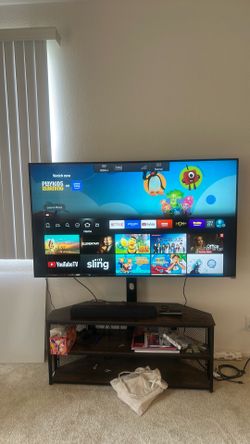 65” Smart TV (free stand)