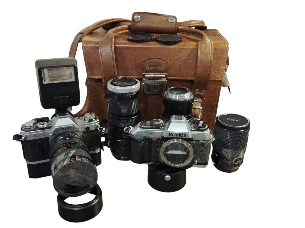 Lot of shops vintage canon camera lenses and flash