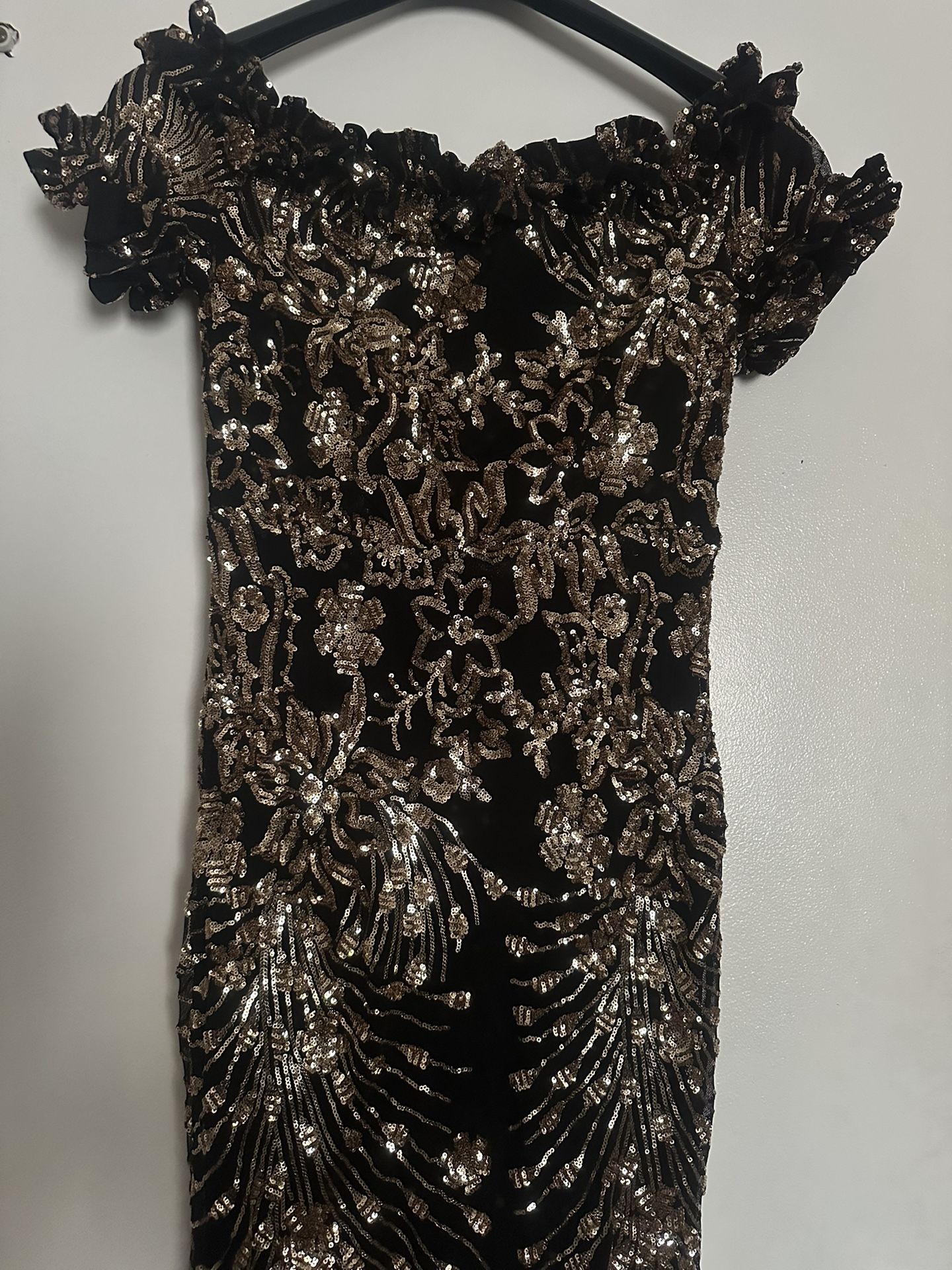 A Beautiful Black And Gold Dress