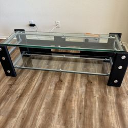 TV Stand, Thick Glass Panels And Steel Frame $100
