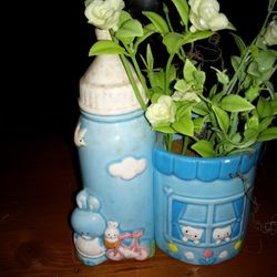 Blue Baby Bottle Planter With Fake Flowers